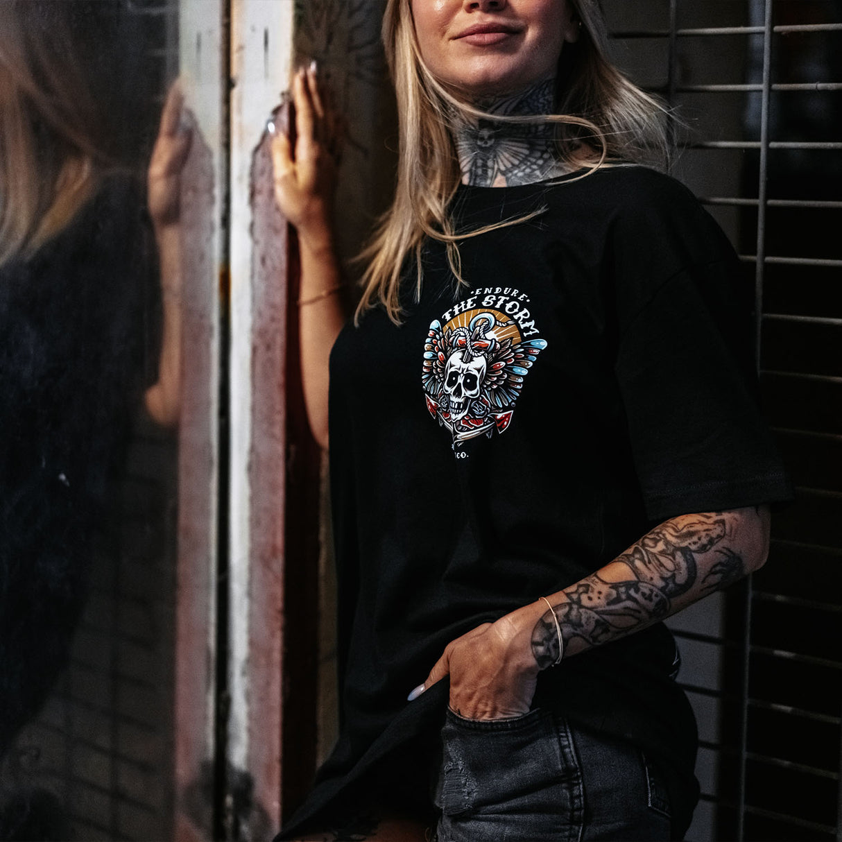 Female model wearing unisex Active Tee with 'Endure The Storm' graphic