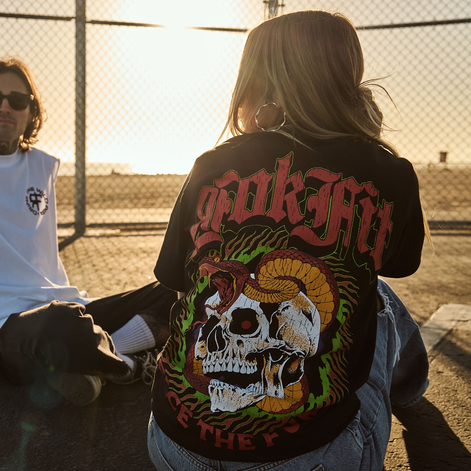 Female model outdoors wearing a unisex Street Tee with 'Face The Fury' graphic