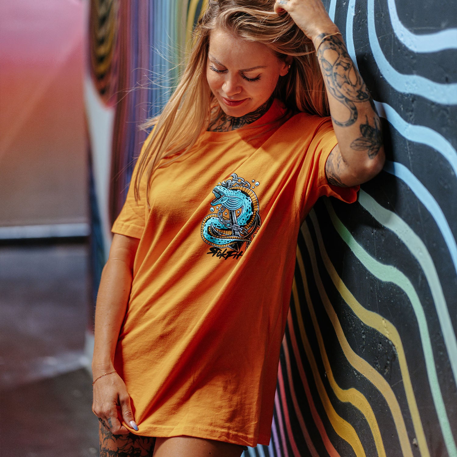 Female model outdoors wearing unisex Active Tee with 'Prepare For The Unknown' graphic