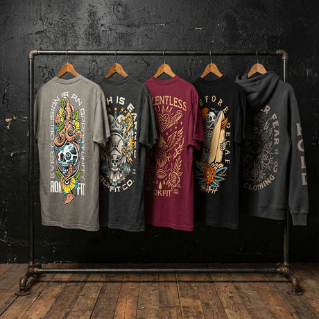 RokFit restock featuring graphic tees and Focus Over Fear hoodie on industrial clothing rack.