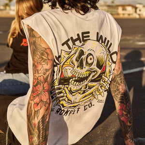Male model outdoors wearing a sleeveless street tee with 'Drink The Wild Air' graphic