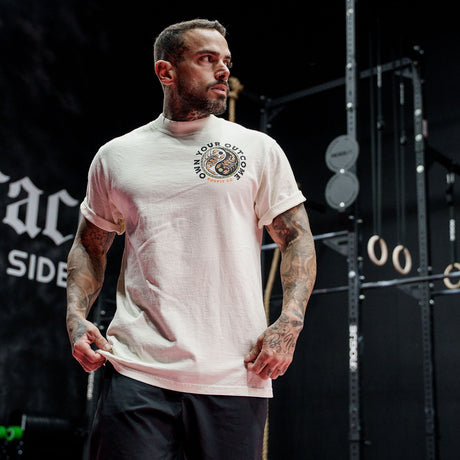 Male model in a gym wearing Street Tee with 'Excuses or Reasons' graphic