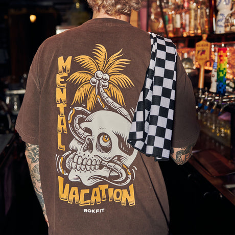 Male model showing Utility Towel draped over shoulder in bar with 'Checker' graphic