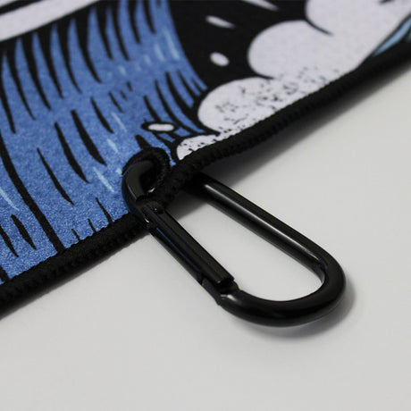 Close up of Utility Towel black carabiner clip with 'Own The Grind' graphic